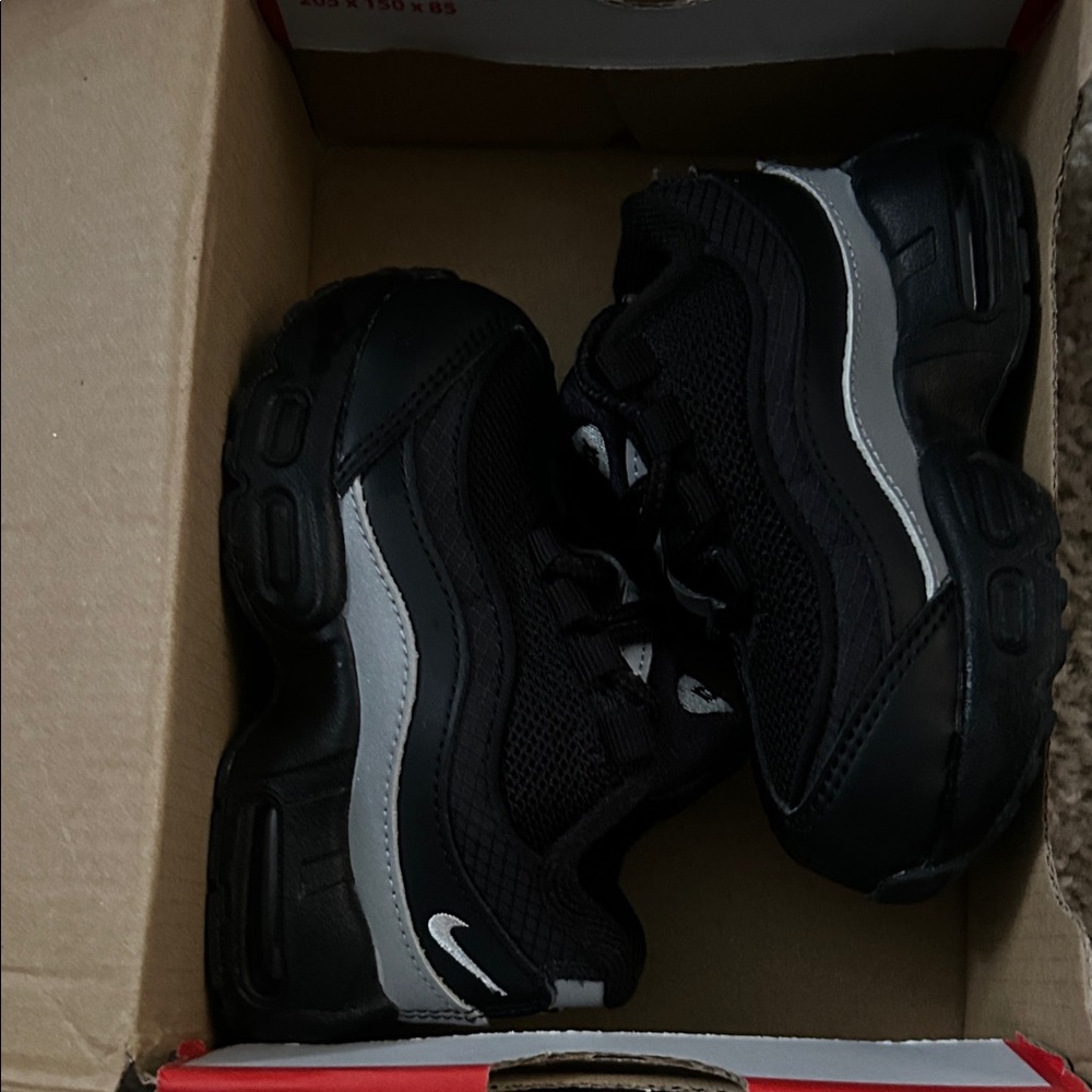 Nike Kids Black Sneakers with Silver Reflective Stripe